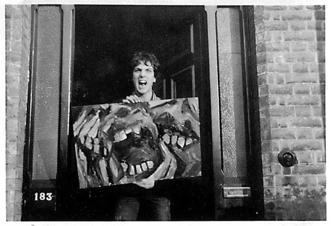 Syd Barrett holding one of his paintings